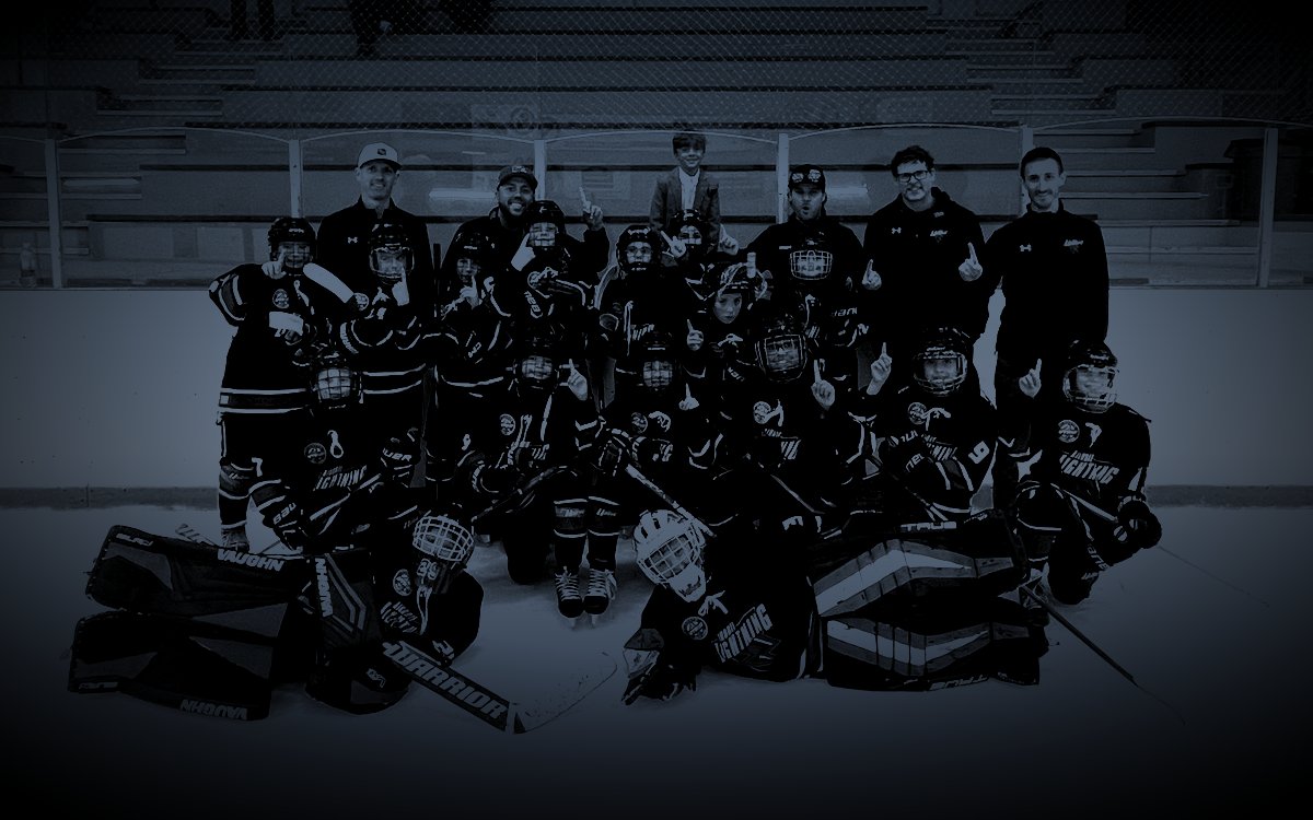 The Lightning team photo after winning the Ice Breaker final, with Max behind the glass